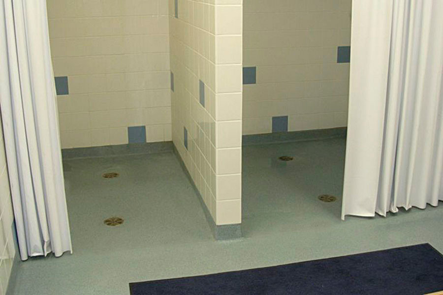 Institutional bathroom concrete floor coatings